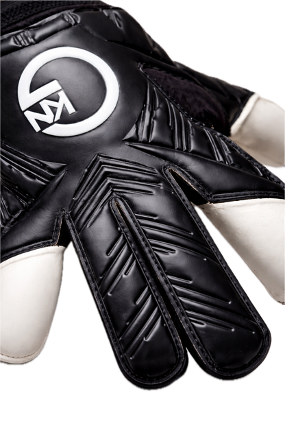 GKN goalkeeper gloves black backhand close-up showing embossed latex detailing and white palm material